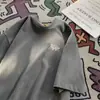 Camiseta Gris de Manga Corta Japonesa para Niños Verano 2025 Nueva Adolescente cityboy Holgada Combinable Cuello Redondo Media Manga