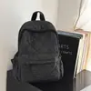 Mochila xadrez estilo coreano 2026 transfronteiriça, uma mochila diária de grande capacidade, leve e simples para estudantes do sexo feminino
