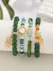 Pulseira Multicamadas Atacado Artesanato em Vidro Joias com Contas Conjunto de Quatro Peças Conjunto de Pulseiras Elásticas Base de Flor de Ferro Joia de Mão