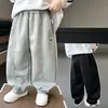 Ropa para niños de comercio exterior para niños 2026 otoño nuevo pantalones deportivos de cachorro estilo coreano modernos geniales pantalones casuales de calle para niños pequeños y medianos