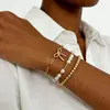 Pulsera de traje combinado de aleación nueva transfronteriza de cuatro piezas pulsera punk hip-hop creativa traje de pulsera pulsera europea y americana