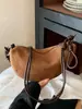 Bolsa feminina estilosa de alta qualidade Shuai Mi Jia, grande capacidade, nova bolsa transversal retrô de nicho outono 2026, bolsa de bolinho