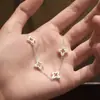 Pulsera de Plata 990 Hueca de Trébol de Cuatro Hojas para Mujer Estilo Antiguo Cepillado Diamante de Punto Cruz Flor de Alto Nivel Lujo Accesible