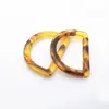 Suministro directo de fábrica hebilla de cintura de resina en forma de D cortavientos hebilla de cintura con patrón semicircular hebilla de traje de baño hebilla de ajuste
