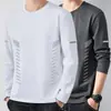 Camiseta casual versátil de manga larga para hombre para otoño, cuello redondo, color liso moderno, cómoda, transpirable y de corte holgado.