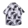 Camiseta de manga corta para hombre con estampado floral estilo tinta, camisa de playa holgada talla grande, conjunto retro de dos piezas estilo Hong Kong al por mayor
