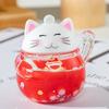 Llavero con colgante de bolsa y botella de arena movediza acrílica con forma de gato de la suerte rojo y rojo, venta al por mayor