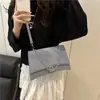 Textura de Alta Qualidade 2026 Inverno Nova Moda Corrente Versátil Elegante Simples Bolsa de Ombro/Axila para Mulheres Transfronteiriça