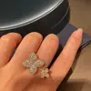 Anel Flor de Quatro Folhas Cravejado com Diamantes Brilhantes Novo Estilo Venda por Atacado Design de Nicho Luxo Leve High-End Ajustável Anel Aberto para Mulheres