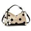Bolso bandolera de lunares estilo francés para mujer, bolso bandolera de hombro nuevo estilo coreano, versión coreana de bolso para mujer más vendido al por mayor