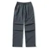 Calça longa casual Sidalet para casal, de corte solto, estilo workwear, perna reta e larga, com múltiplos bolsos, apresentando um design relaxado e estiloso.