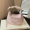 Bolso pequeño de lunares transfronterizo 2026, bolso de mano girly con lazo, bolso cruzado mini compacto y exquisito