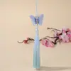 Bordado de mariposa en degradado dorado estilo nacional falda antigua con cara de caballo accesorios colgantes borla de púas hecha a mano joyería al por mayor