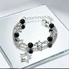 Pulsera Punk Popular Transfronteriza Europea y Americana Estilo Punk Negra con Perlas Huecas de Estrella de Cinco Puntas Estilo Nuevo Doble Capa Superpuesta Pulsera para Hombres y Mujeres