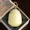 Fabricante Reloj Redondo Apilable Lata de Té Pequeña Portátil Cerámica Uso Doméstico Sensación de Alta Gama Lata de Té Lata Sellada 2026 Nuevo Estilo
