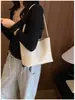 Bolsa estilosa 2026, bolsa de balde preta tecida casual simples da moda, bolsa de ombro com design de nicho super popular