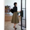Falda plisada de cintura alta para mujer 2026 Nuevo estilo de otoño Retro francés de longitud media ajustada elegante de color liso falda de línea A