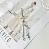 Fábrica Fonte Corrente de Celular Acrílica com Laço Coreano Chaveiro Coringa Cabelo Decorativo de Bolsa