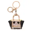 Procesamiento personalizado bolsa transfronteriza modelado colgante de llave aleación de diamante llavero colgante collar broche personalizado