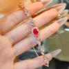 Anillo de rubí de estilo chino de gran venta en vivo para mujer, elegante conjunto de cuatro piezas de joyería, collar, pendientes y pulsera.