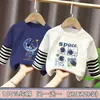 Camiseta de manga larga de algodón puro para niño, nuevo modelo primavera y otoño 2026, camiseta básica con estampado de dibujos animados para niño, top falso de dos piezas, moderno