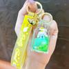 Llavero creativo de perro gui de jade en botella cuadrada de aceite, lindo llavero de botella de arena movediza a la deriva, llavero de coche, pequeño regalo al por mayor