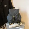 Mochila coreana con cordón y múltiples bolsillos para mujer 2026 Otoño Gran Capacidad Versátil Mezclilla para Viajes y Uso Diario