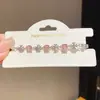 Pulsera de cruz de circonita estilo ins coreano, pulsera de nicho de lujo ligero de alta gama, joyería de moda y versátil al por mayor