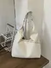Bolsa Tote Personalizada com Rebites Cor Sólida de Grande Capacidade Design de Nicho para Mulheres 2026 Primavera Novo Estilo Bolsa de Ombro Único