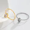 Anillo de acero de titanio con personalidad de moda de lujo ligero con circonita en forma de gota de agua y temperamento de diseño europeo y americano, no se decolora, venta al por mayor que combina con todo
