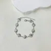 Moda de personalidad europea y americana serie marina acero inoxidable carcasa hueca tridimensional traje de collar y pulsera en stock venta al por mayor