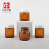 Botella de crema con tapa peel-off de 10 g, frasco de vidrio para mascarilla facial con doble sello marrón, botella vacía dispensadora de producto para el cuidado de la piel, personalizable para venta al por mayor