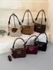 Bolso de hombro vintage de gamuza modelo nuevo 2026, bolso cruzado versátil de nicho para el día a día con correa de hombro de cuerda trenzada, bolso de axila con sensación de alta gama