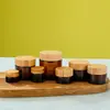 Seleção por atacado de tampas de bambu e madeira para potes de creme marrons, potes de creme para os olhos e potes de creme facial, 5g-100g, frascos dispensadores cosméticos, em estoque
