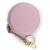 Bolsa de monedas redonda de PU personalizada de fábrica, bolsa creativa para llaves, mini bolsa personalizada simple y portátil para llaves y auriculares