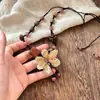 Nuevo collar de flor de Bodhi estilo chino para mujer, cadena larga de suéter de madera tradicional, nuevo accesorio de cordón estilo étnico 2025