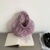 Bolsa coreana con diseño de nicho, estilo femenino, bolsa de lunares plisada, nuevo modelo de verano 2026, bolso de mano casual suave