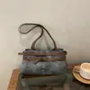 Bolsas de mujer de diseño de nicho europeo y americano, bolsos de mujer de estilo vintage, bolsos de hombro de moda casual, bolsos de axila elegantes y sencillos para el día a día
