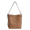 Bolso de axila para mujer estilo coreano, nuevo bolso cubo hueco de moda primavera 2026, alto valor estético, bolso cruzado de gran capacidad