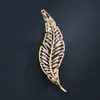 Deseo Amazon venta caliente transfronteriza diseño de hoja coreana cobre electrochapado oro real broche accesorios para abrigo
