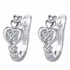 Deseo comercio exterior venta caliente moda amor hebilla de oreja incrustaciones de diamante geométricos huecos forma de corazón de melocotón aretes aro de oreja aretes al por mayor