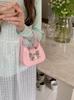 Bolso de mano con lazo de nicho, nuevo bolso de primavera y verano a la moda, dulce y moderno, mini bolso bandolera con cadena de lápiz labial, mini bolso pequeño para mujer