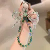 Cordão Antiperda com Contas de Cristal e Borla de Flor para Decoração de Mochila, Acessório de Celular Versátil e Requintado Estilo Coreano