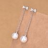 Qiaolanxuan Plata Pura Aguja Lazo Elegante Estilo Coreano Personalizado Aretes de Perla Estilo Largo Yiwu Joyería Aretes Venta al por Mayor