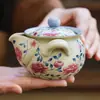 Tetera de cerámica hecha en fábrica con diseños de loto y peonía, juego de té kung fu de alta gama, tetera de mano con separación de té y agua, tetera individual