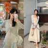 Top de punto de alta calidad en color verde claro con cordones para mujer, nuevo estilo de verano, corte holgado, estilo coreano, top fino