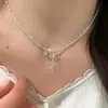 Collar de Perlas con Lazo de Plata Roto Lujo Accesible Nicho Cadena para Clavícula de Gama Alta 2025 Nuevos Accesorios para Collar Modelo de Mujer