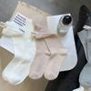 Calcetines de felpa con etiqueta en el talón para niños, primavera y otoño, viento frío, nicho, ins, moda, color liso, versátil, negro, tubo largo, calcetines de moda