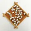 Perla de imitación de agujero medio de aguja única para resaltar el abdomen con accesorios de diamante colgante de perla suelta blanca hecho a mano para bricolaje al por mayor