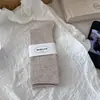 Meias de Algodão Sem Costura de Micro-Pressão Cor Sólida Estilo Coreano Ins Novas para Outono e Inverno Meias Versáteis de Costela Meia Cano Médio Meias Femininas Meias Brancas Largas